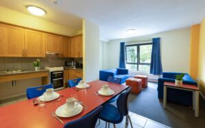 Common area with dining room, kitchen and sitting room.